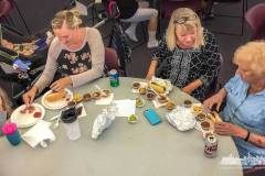 Four generations of chili fans dine on the variety of chili served at the 10th Annual WCUCC Cruise-In and Chili Cook-Off that moved indoors to serve chili due to the rain. My Final Photo for Oct. 8, 2017. 
