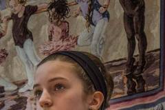 A dancer standing beneath a small tapestry of younger dancers listens to instructions during a late afternoon class at Generations. My Final Photo for Feb. 19, 2014.