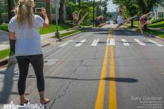 Jazmine Pfeifer of Generations Performing Arts Center photographs four of her dancers who leap in the crosswalk on Main St. at Otterbein University. My Final Photo for June 18, 2015.