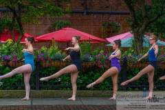 Dancers from Generations use the flower baskets along Jimmy V's patio wall as their barre as they practice outdoors during a summer class. My Final Photo for June 25, 2014.