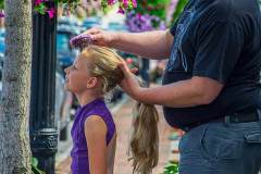 Eight-year-old Elle smiles as her father, Andrew Shroads,  combs her hair before putting it into a dancer's bun for her dance class at Generations Performing Arts Center in Uptown Westerville. My Final Photo for Aug. 20, 2015.