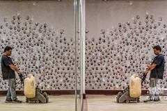 A floor installer sands and cleans the poplar floors at Generations dance studio in preparation for being resealed while the students are taking time off for the Christmas holiday. My Final Photo for Dec. 21, 2013.