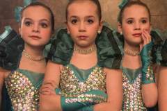 A trio of dancers stand in the wings watching younger dancer on stage during a performance by Generations Dancers foe second graders at Hanby Elementary. My Final Photo for March 10, 2017.