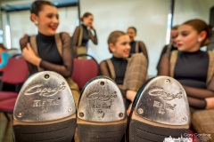Generations dancers rest their tap shoed toes as they wait their turn to have their photos made during the dance studio's annual photo week where all the dancers are photographed for each of the disciplines they learn. My Final Photo for March 8, 2023. 