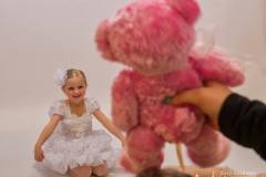  A Generations Performing Arts dancer smiles as instructed by the photographer's assistant and her pink bear during the annual photo shoot at the studio. My Final Photo for March 8, 2018.