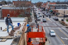 A pair of brickmasons repair the parapet at The Gathering Place on North State Street in Uptown Westerville. My Final Photo for November 20, 2023.