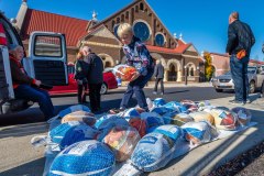 Volunteers stack almost 400 frozen turkeys donated Sunday morning at St. Paul the Apostle Catholic Church for the food kitchen at Holy Rosary/St. John in downtown Columbus. My Final Photo for November 19, 2023. 