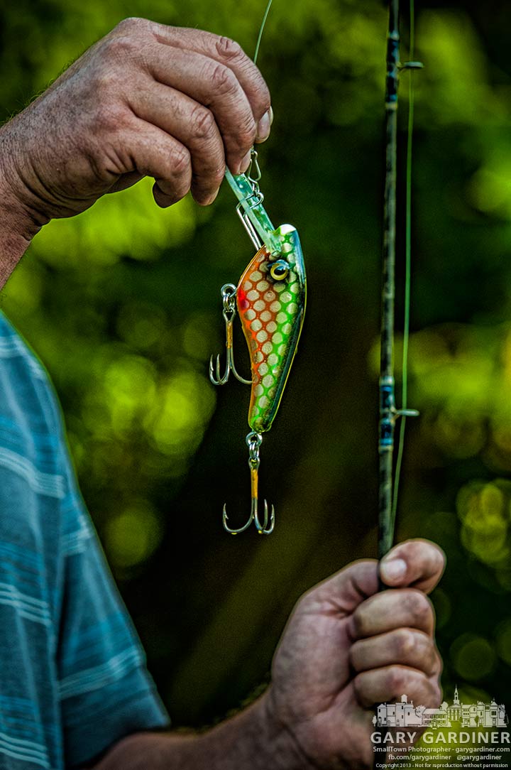 Cliff Honeycutt displays a modified Alley Cat Lure he tested in the waters below the Alum Creek Park low-head dam. My Final Photo for July 24, 2013.