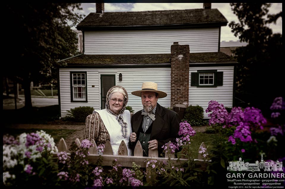 Benjamin Hanby re-enactors stand at the garden fence  outside the Hanby House as part of the Tapestry Of A Town historic tour of Uptown Westerville. My Final Photo for July 28, 2013.