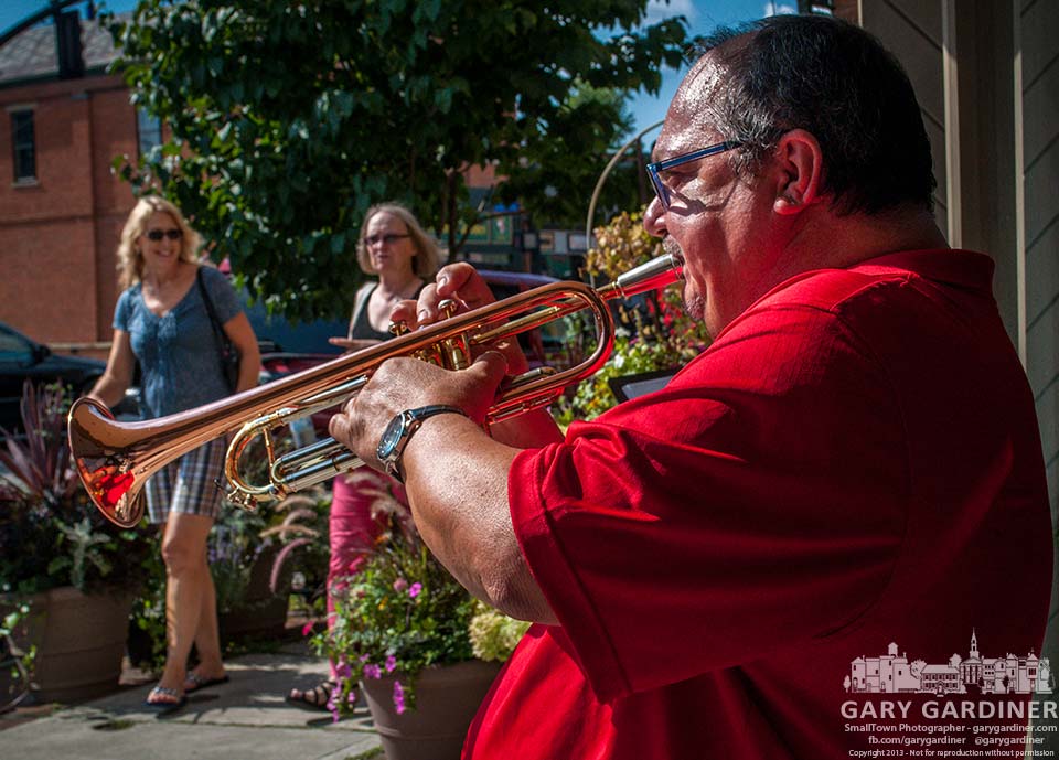 Steve Titus performs on his trumpet in front of A Gal Named Cinda Lou as part of the Rock the 'Ville event in Uptown Westerville. My Final Photo for Aug. 10, 2013.