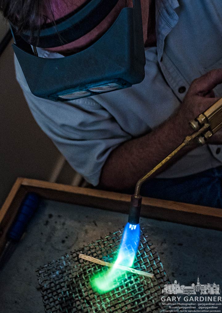 Jeweler Bill Morgan uses a torch to anneal a piece of carved silver destined to b e a wedding ring. My Final Photo for Sept. 13, 2013.