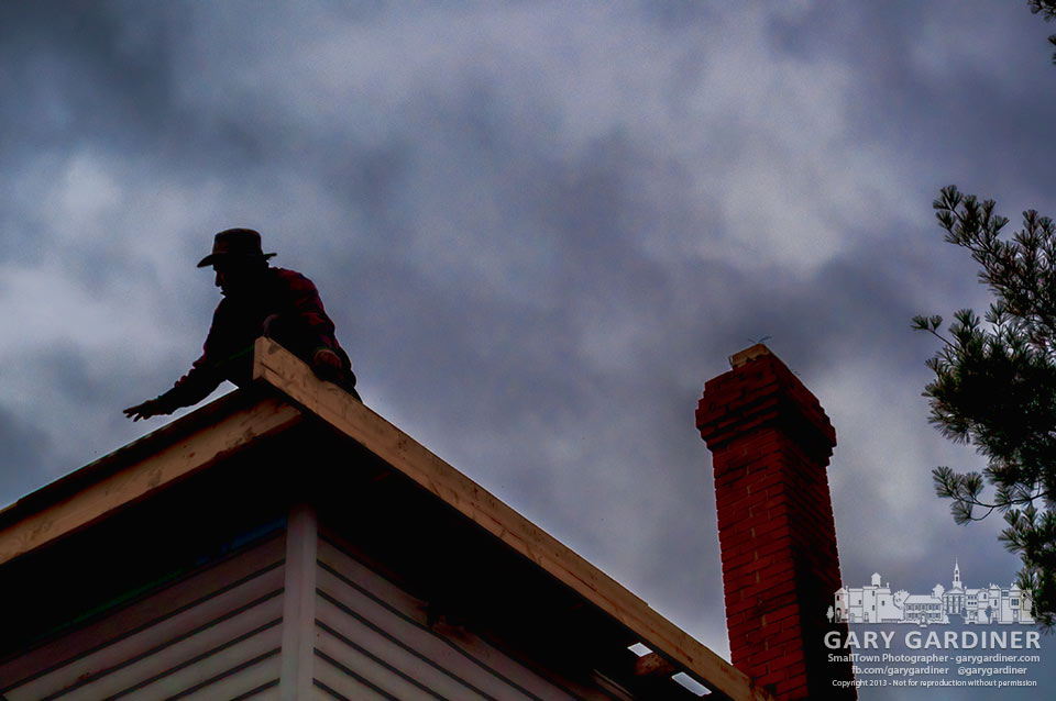 Work crew replaces the attic and roof of a house On Home Street that was heavily damaged by a recent fire. My Final Photo for Nov. 21, 2013.