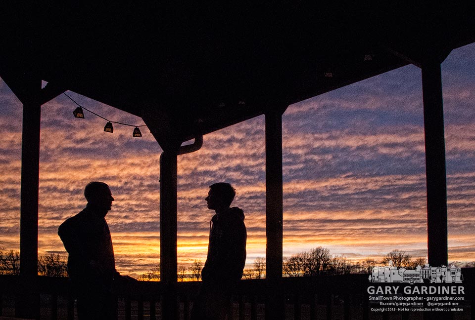 Father and his teenage son talk before dinner on a warm Sunday afternoon at sunset. My Final Photo for Dec. 22, 2013.