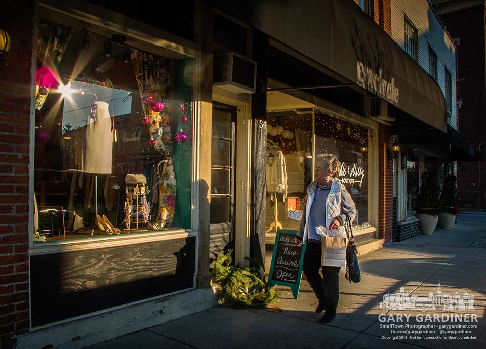 A shopper looks at the DeDe &Dolly window display as she shops late on a Friday afternoon in Uptown Westerville. My final Photo for Dec. 27, 2013.