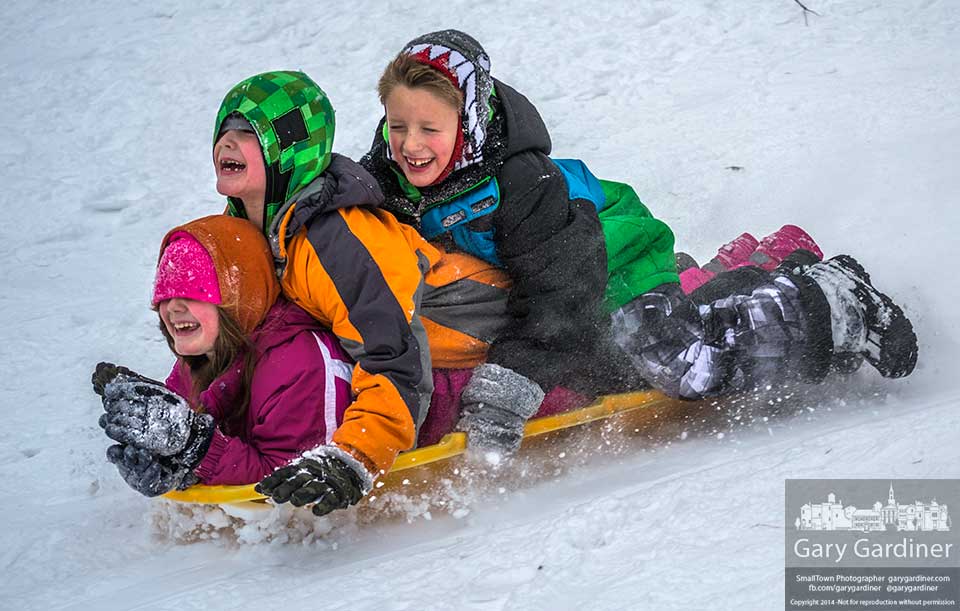 A trio of youngsters share a ride down the sledding hill at Alum Creek Park after a fresh snowfall. My Final Photo for Jan. 26, 2014.
