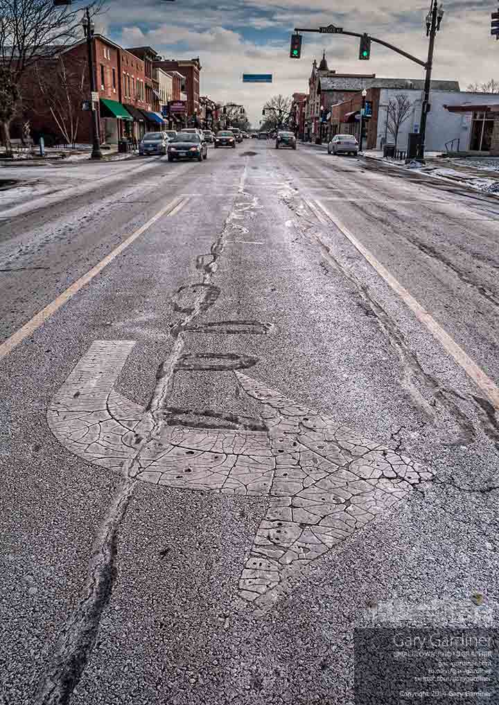 A coating of salt and brine cover some streets after they were treated in anticipation of a heavy snowfall that never happened. My Final Photo for Jan. 7, 2014.