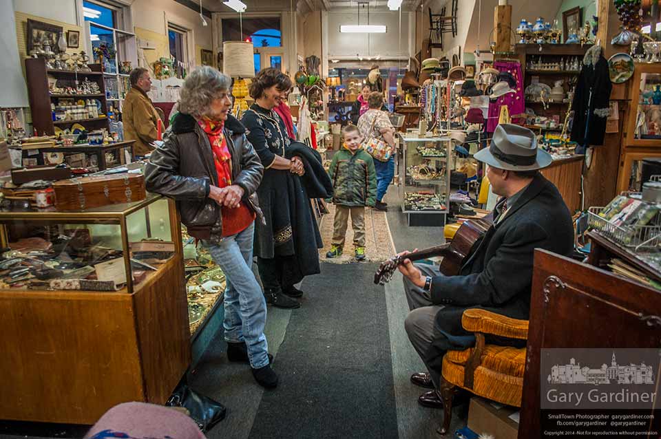 Rock-a-billy singer and guitarist Slick Andrews entertains a small crowd with an impromptu concert at closing at Westerville Antiques. My Final Photo for Feb. 1, 2014.