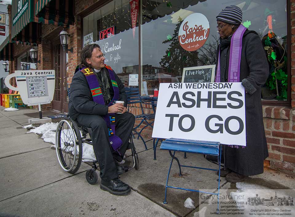Episcopal religious offer Ash Wednesday services on the sidewalk in front of Java Central in an attempt to help people understand the importance of the holy day day. My Final Photo for March 5, 2014.
