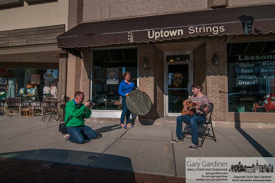 Chris and Julie Hedrick of Blue Skies Video photograph a senior high school student on the sidewalk in Uptown Westerville. My Final Photo for April 23, 2014.