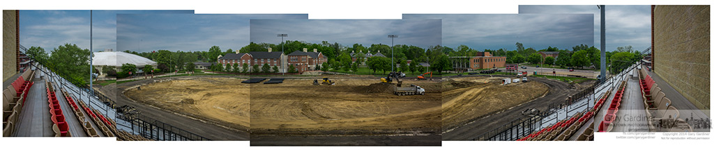 Contractors rush to remove unneeded dirt from Otterbein's football field before thunderstorms arrive stopping construction  of an artificial surface field and a new track. My Final Photo for May 20, 2014.
