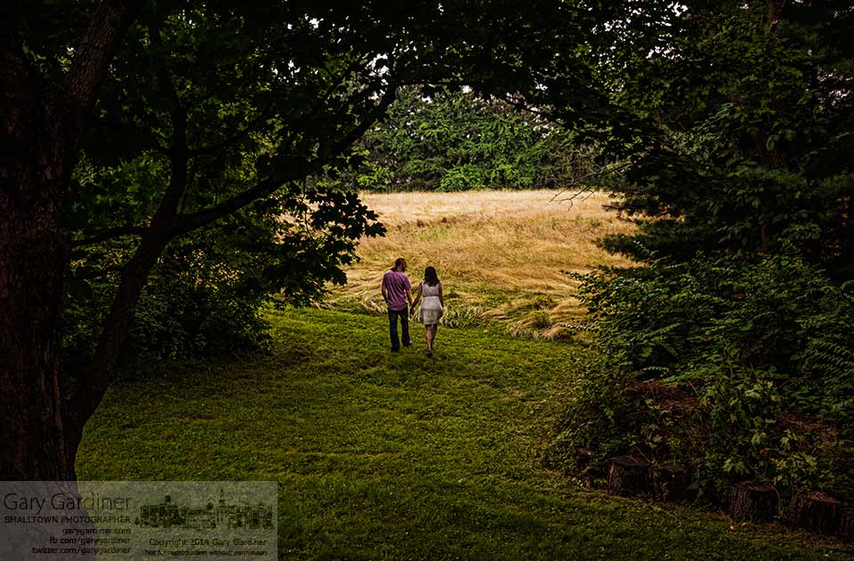 A newly married couple take a walk during a break in the rain during a delayed reception with family and friends. My Final Photo for June 28, 2014.