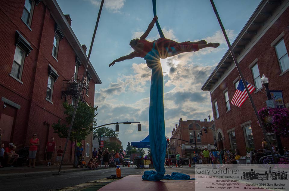 A aerial acrobat performs on closed State Street during Friday's Rock the 'Ville celebration in Uptown Westerville. My Final Photo for August 9, 2014.