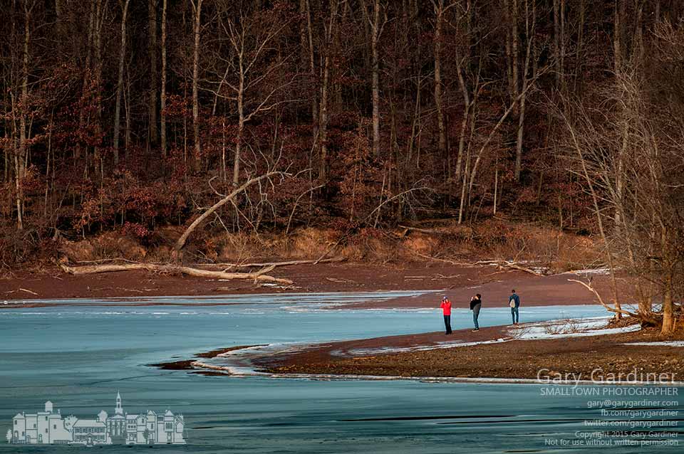 A trio of young photographers travel the icy shoreline of Hoover Reservoir on a warm winter afternoon looking for subjects. My Final Photo for Jan. 17, 2015.