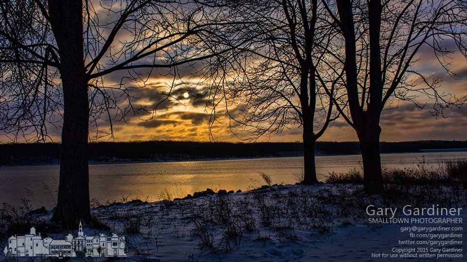 The rising sun shines through a winter cloud bank along the eastern shore of Hoover Reservoir. My Final Photo for Jan. 9, 2015.