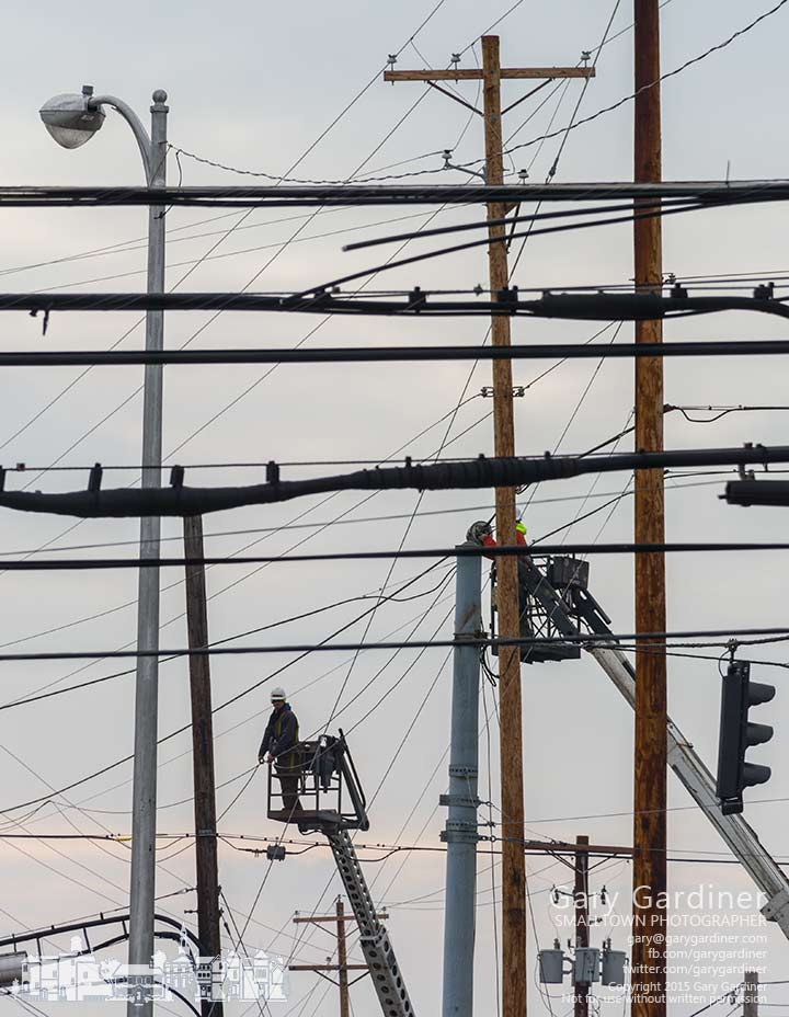 Utility workers upgrade section of overhead wiring along a section of 3C Highway in Blendon Township south of I-270. My Final Photo for Jan. 16, 2015.