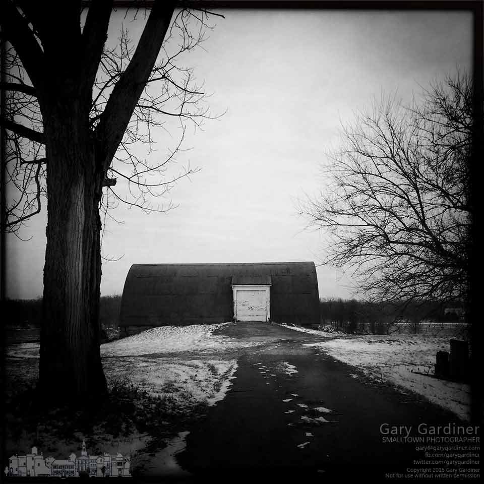 A grey sky on a cold winter day hangs over the Braun Farm in this black and white photo. My Final Photo for Feb. 16, 2015.