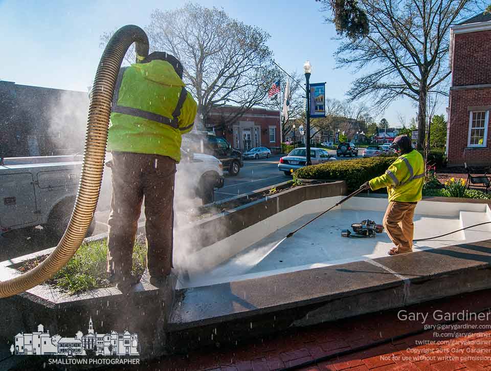 City workers steam cleans the small park at the corner of city hall in anticipation of the first Fourth Friday of the summer when the park is used for children's events. My Final Photo for April 23, 2015.