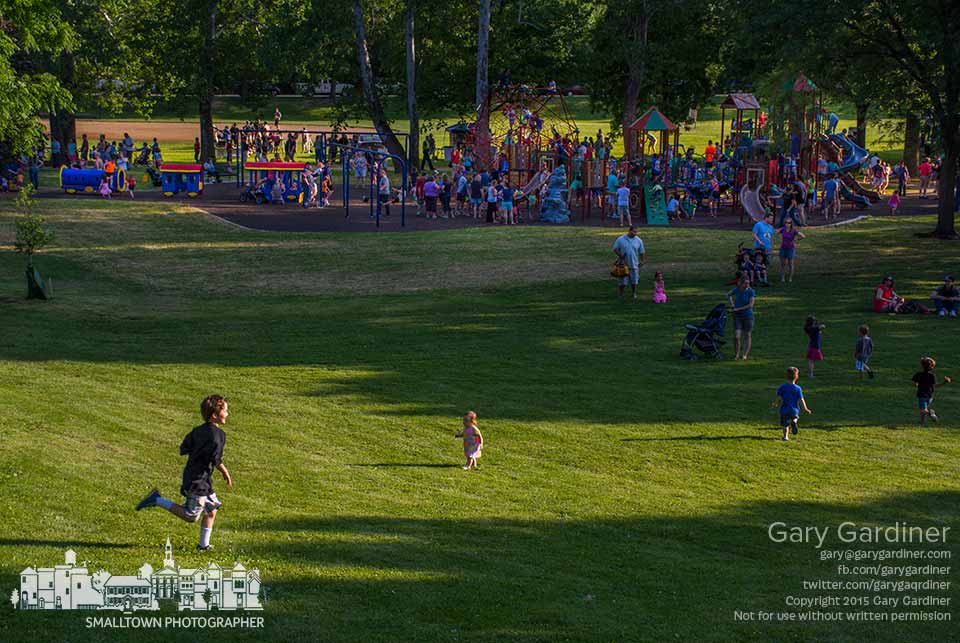 Kids frolic across the freshly cut lawn at Alum Creek Park where Party at the Creek celebrates the installation of all new playground equipment. My Final Photo for May 28, 2015.