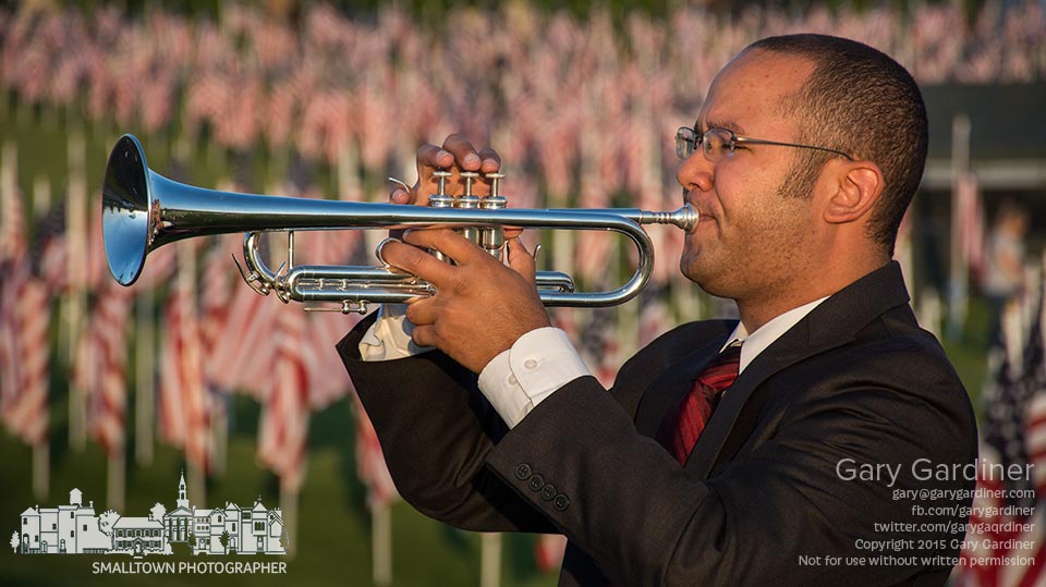 Bugler Martin warms up before delivering TAPS at the Westerville Rotary Field of Heroes flag display at sunset. My Final Photo for May 23, 2015.