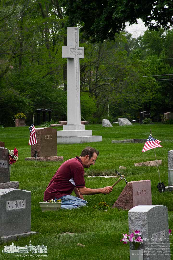 A man tends his mother's grave on Mothers Day in Blendon Township Cemetery. My Final Photo for May 10, 2015.