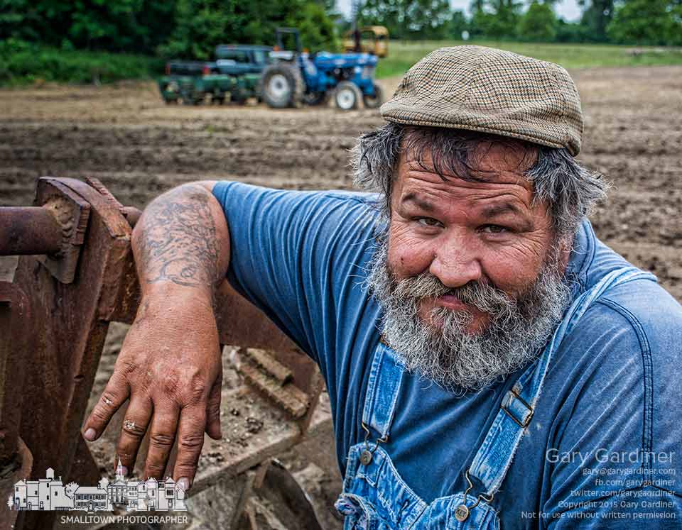Tom, one of the brothers who planted soybeans at the Braun Farm, relaxes for a moment after lubricating the planter and tractor used to plant seed. My Final Photo for June 3, 2015.