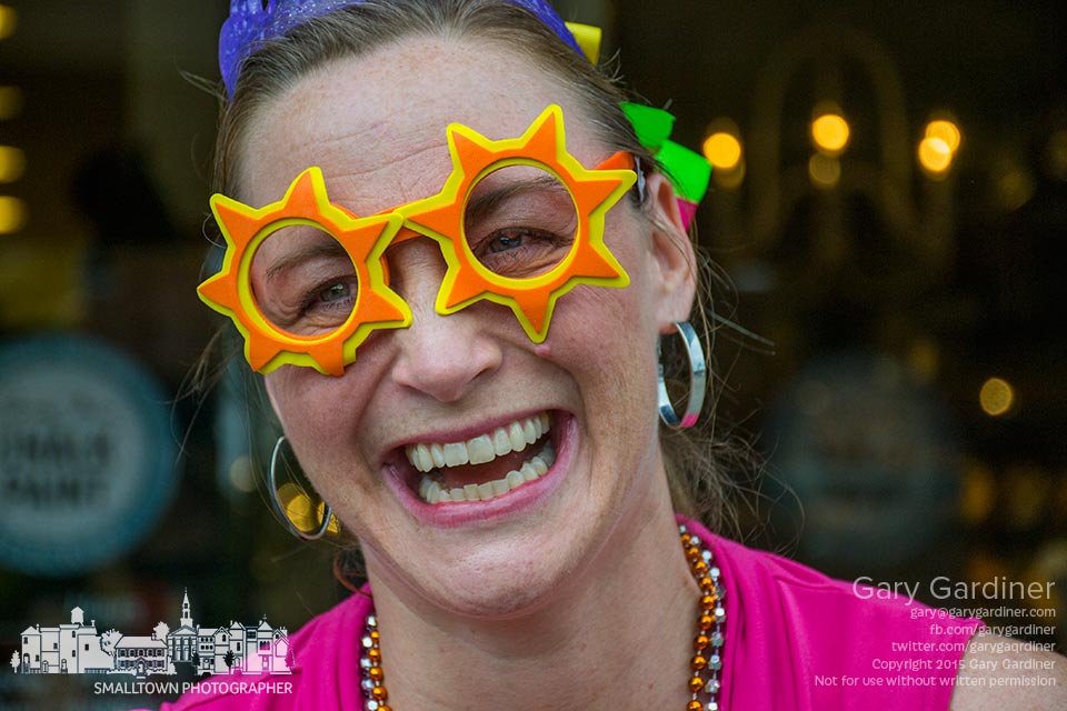 Wearing sunburst glasses, outlandish clothes, and a laugh, one of the participants in the Young Professionals Uptown Shuffle smiles as her team prepares for the annual scavenger hunt in Uptown Westerville. My Final Photo for June 5, 2015.