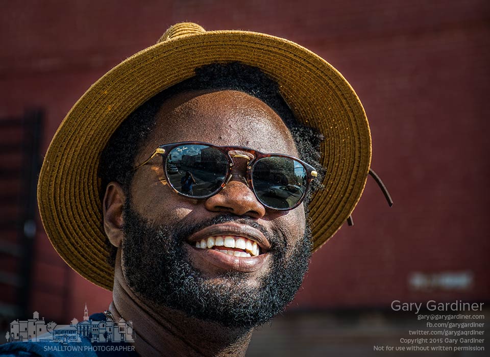 Man wearing a straw hat against the hot afternoon sun smiles as he waits to cross State St. in Uptown Westerville. My Final Photo for Aug. 30, 2015.