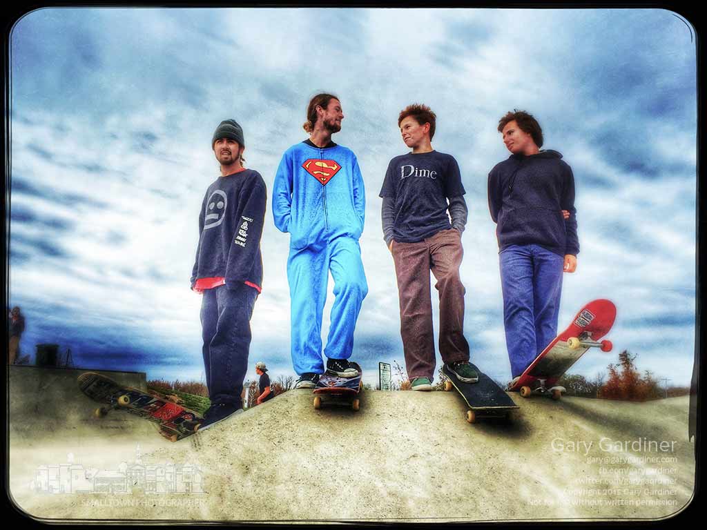 A quartet of skaters stands atop one of the ridges at the Westerville skate park where OldSkool Skateshop held it annual Halloween competition skate. My Final Photo for Oct. 31, 2015.