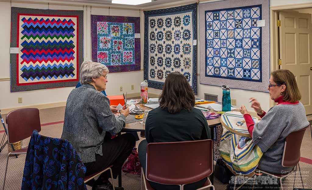 Quilters from the Columbus Metropolitan Quilters cut quilt patterns as quilts from the group are displayed at the Innis House at Inniswood Metro Gardens. My Final Photo for January 31, 2016.