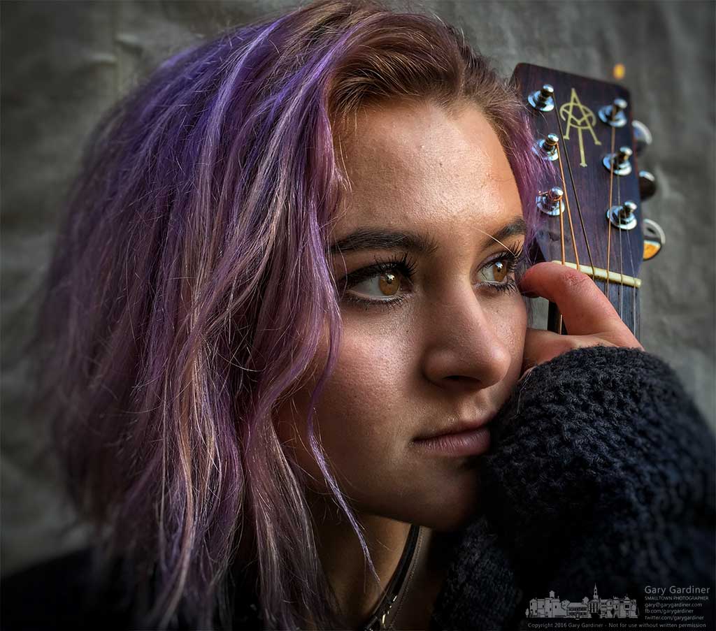 A singer-guitarist poses after her performance during Pure Roots grand reopening in Uptown. My Final Photo for January 30, 30