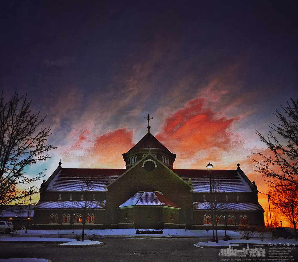 The sunrise brings vibrant color and warmth to St. Paul the Apostle Catholic Church on the first day of Lent.