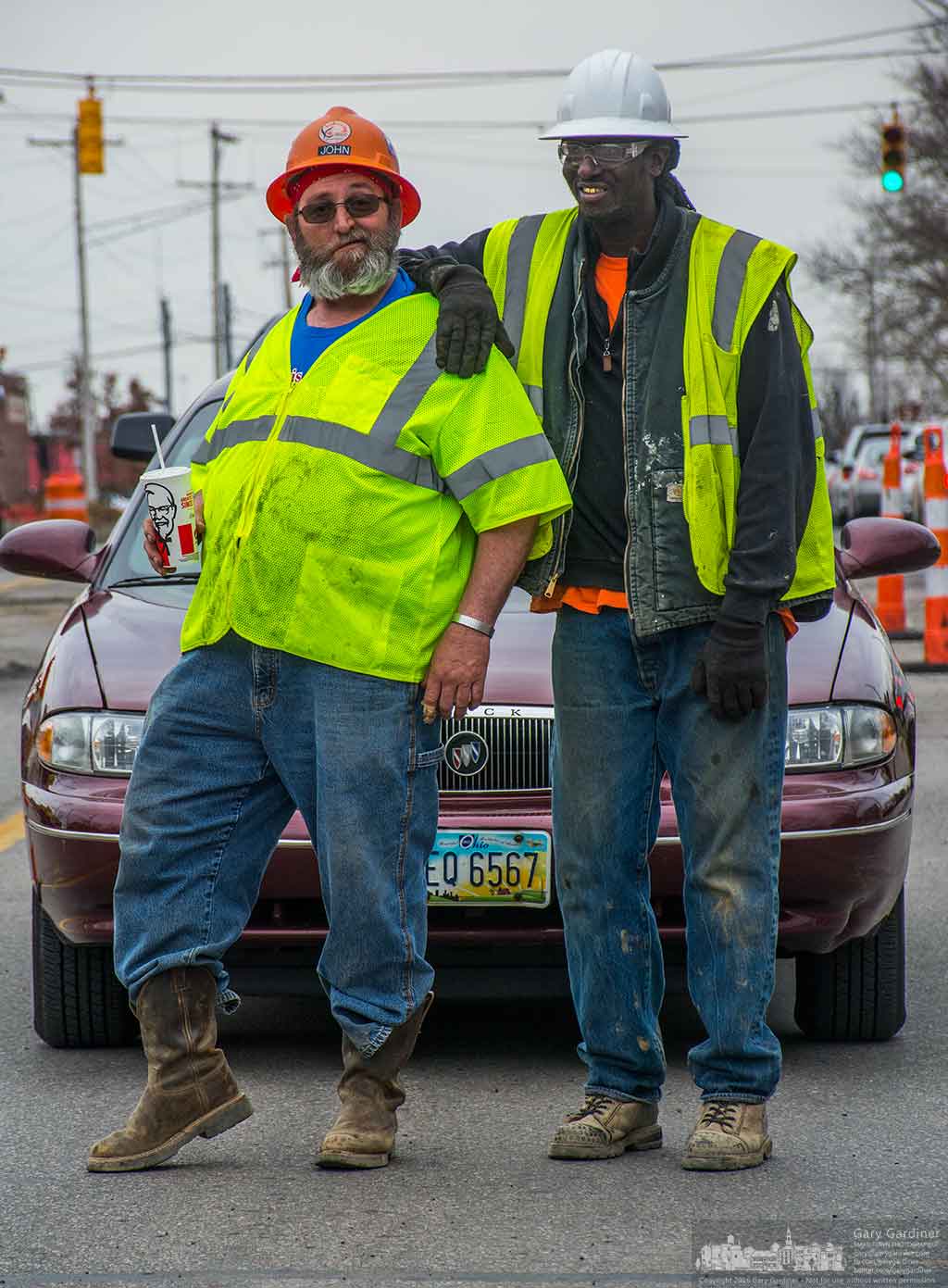 A road work crew takes a moment to pose while stopping traffic to repair sections of State street torn up during recent construction to install underground utilities beneath the roadway. My Final Photo for March 9, 2016.