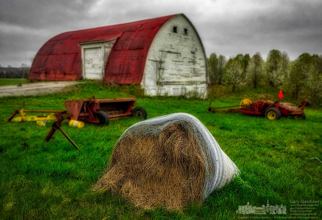 A rolled hay bale on the Braun Farm collapses under the weight of winter's burden as a front with freezing temperatures brings what is hoped to be the last breath of winter to Westerville. My Final Photo for April, 4, 2016.