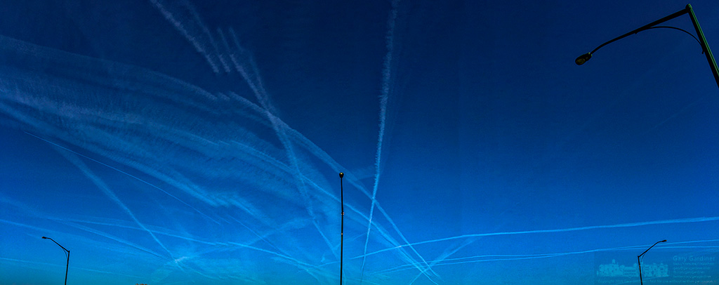 A series of early morning contrails slice through the western sky. My Final Photo for April 14, 2016.