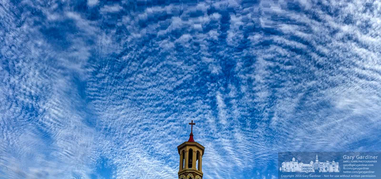 The old church steeple for St. Paul the Apostle Catholic Church sits under a cloudy blue sky on a Sunday morning. My Final Photo for May 22, 2016.