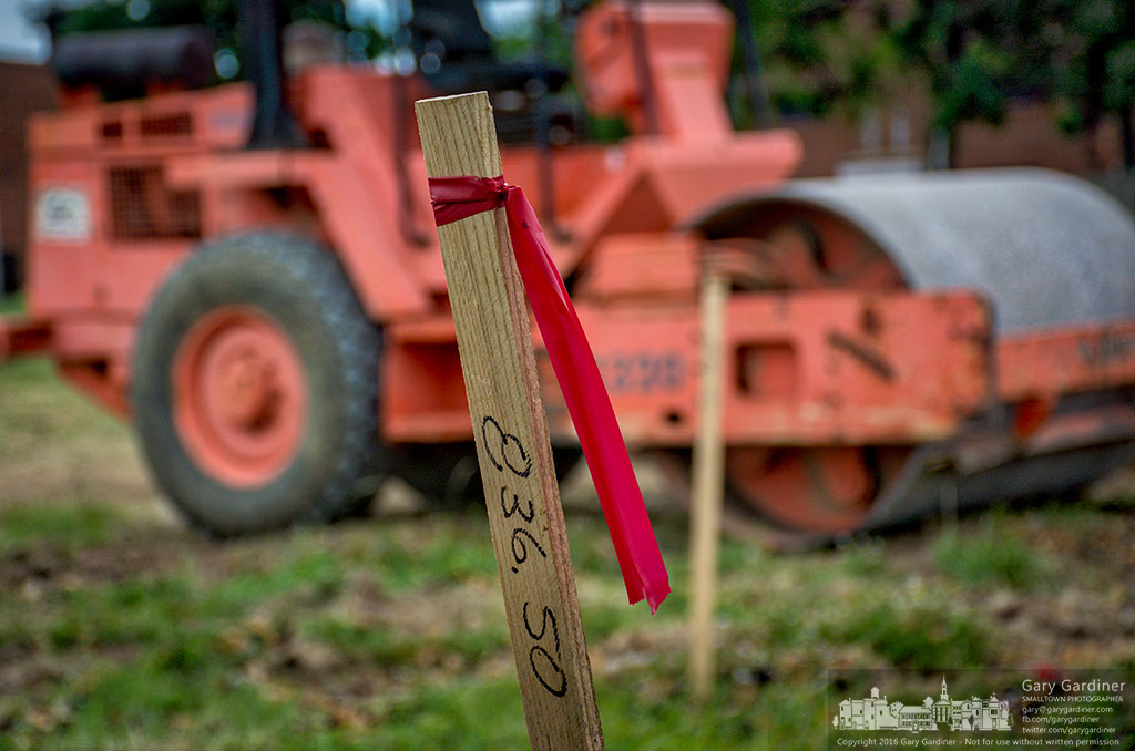 A flagged survey stick marks a corner where contractors began Wednesday building the Aloft Hotel on Heatherdown Drive where the Knight’s Inn once stood. My Final Photo for June 22, 2016.