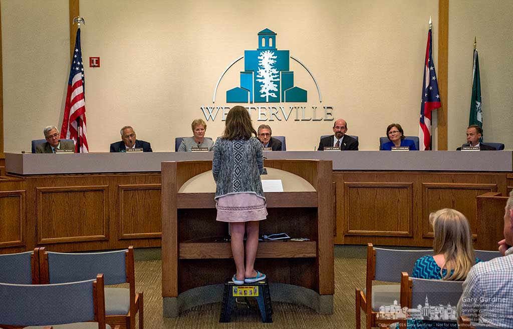 Nine-year-old Sophie Cardillo uses a step stool to elevate herself above the podium to speak to the Westerville city council about her concerns about the possible harmful effects of cell towers placed close to schools. My Final Photo for June 7, 2016.