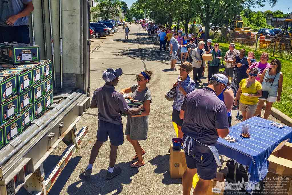 The line for the Georgia Peach Truck runs from the corner of the front parking lot to behind Raisin Rack which sponsors the annual one-day-year sale of fresh fruit in Westerville, Ohio. My Final Photo for June 25, 2016.