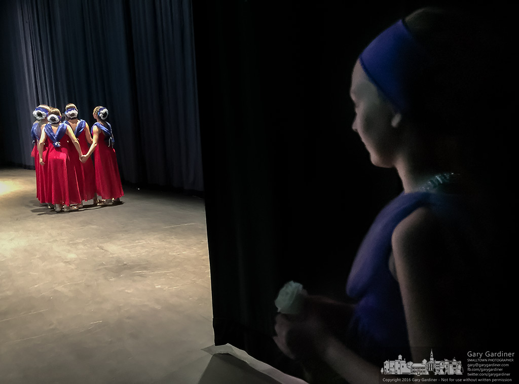 A dancer waits in the wings as a group of dancers prepare themselves for the next act during the dress rehearsal for Generations "The Pride and Spirit of America" show at Westerville Central. My Final Photo for July 2, 2016.