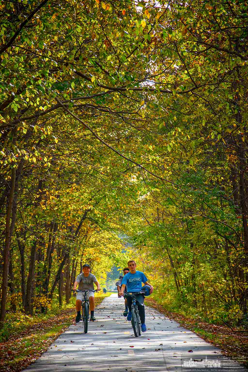 Bicyclists travel down the Ohio to Erie bike path in Genoa Township on a warm fall afternoon. My Final Photo for Oct. 29, 2016.